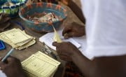 Scenes from a VSLA meeting in Sierra Leone. Photos: Kieran McConville / Concern Worldwide