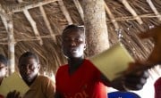 Scenes from a VSLA meeting in Sierra Leone. Photos: Kieran McConville / Concern Worldwide
