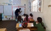 Children attending non-formal educational activities in literacy in an educational centre in Syria