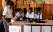 Students in Maikona girls Secondary school take part in a science experiment, using mobile labs facilitated by Datatec and Concern Worldwide. Photo: Shaloam Strooper/Concern Worldwide