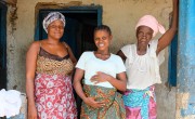 Pregnant mum Safinatu Kamara (22) with her aunt and grandmother at the family home in Mambolo, Sierra Leone. The health centre that Safinatu is attending for her pregnancy is supported by Concern. Photo: Darren Vaughan/Concern Worldwide