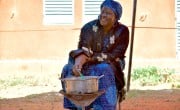 Concern's Harira Yagi gives a cooking demonstration to show households who will receive fortified flour in Tahoua how to make porridge. Photo: Concern Worldwide