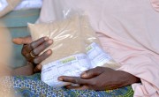 Baria Moumouni receives fortified flour in Tanawara village. Photo: Concern Worldwide