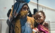 Mother Jemila* and baby Nisa* receive therapeutic food from the Concern supported health clinic in one of the displacement camps in Tuban district where Concern provides health and nutrition services. Photo: Concern Worldwide