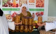 A girl helps top sell food produced by a Concern supported Self-Help group in Afghanistan.