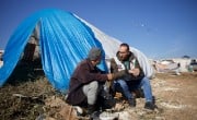 Muhammed Kronfol meets with his fellow displaced Syrians to see the conditions of those affected by the earthquake and their needs.