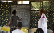 An adult literacy and numeracy evening class for women in the village of Poweh, Rivercess County, Liberia, supported by Irish Aid. Photo: Kieran McConville/Concern Worldwide