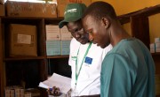 Health and Nutrition Manager Luka Malek Mur and Health Facility Officer check registers in the Irish Aid-funded Lueth Ngor public health clinic, Aweil North, South Sudan. Photo: Hannah Bolder/Concern Worldwide
