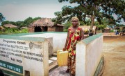 Young mother Dada collects water from the standpipe installed in her village with the support of Concern and Irish Aid. This infrastructure has significantly reduced the challenges she previously faced in accessing safe drinking water in Tanganyika, DRC. Photo: Concern Worldwide