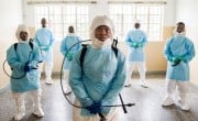 Patrick Bassie, 27, a member of burial Team 7, pictured with other team members at a children's hospital in Freetown, Sierra Leone, during the Ebola outbreak in 2015. Photo: Andrew McConnell/Panos Pictures