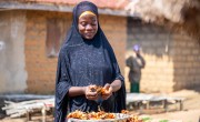 Kadiatu peeling vegetables she grew
