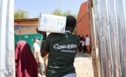 Concern Worldwide staff unloading trucks ahead of food distribution in Filtu, Somali Region, Ethiopia. Photo: Jennifer Nolan / Concern Worldwide