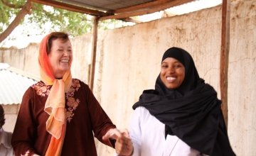 Mary Robinson with healthworker Nadhifa Ibrahim Mohamed. She has worked in Dollow Health Centre  for 3 years and is a certified midwife, Dollow, Somalia. The Somali district of Dollow is situated on the Somali / Ethiopian border.  Dollow town, the district capital, is the border crossing point and is contiguous with Dollow Ado on the Ethiopian side. Dollow is a key transit point between Somalia and Ethiopia in the current crisis with over 1,700  crossing between the two countries on a daily basis. To date 7
