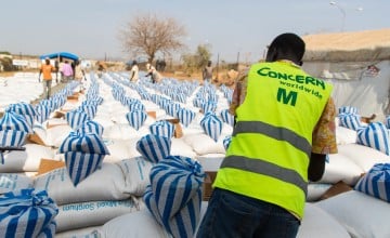 A monthly food distribution in Juba PoC. Food is provided by WHO and the distribution is organised by Concern Worldwide. Each family gets their ration and has to make it last for one month. The distribution takes place over two days to spread out the crowds. Photo: Steve De Neef / Concern Worldwide.