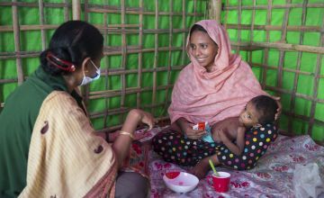 Two year old Hala is assessed by staff at Concern's nutrition centre in Cox's Bazar, Bangladesh. Photo: Kieran McConville / Concern Worldwide. 