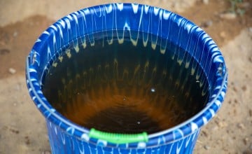 Water from ta local creek in Liberia. Before Concern built the well, this creek was their only water source. Photo: Gavin Douglas/Concern Worldwide.