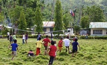 Children at the elementary school in Polopina play soccer