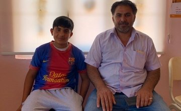 Hassan pictured with his son 14-year-old son Fadi.