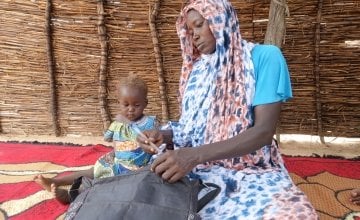 Khamissa Ibrahim is 32 years old. She has six children: Fatouma (9), Ahmad (7), Zakia (5), Aisha (4), Umaima (3) and Rafaida (1 and a half) – pictured – and is six months pregnant. Khamissa is a Concern-trained Community Health Volunteer. She also sells onions, salt, garlic, oil, okra and chili. Before Concern, she worked in the fields to support her family during the lean period. Khamissa is independent and runs her own business. She stores millet, peanut and sesame and from these stores, she loans stock t