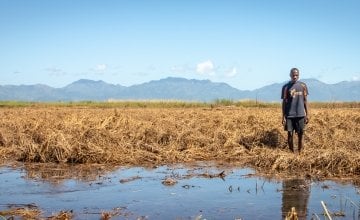 Patrick Ghembo of Monyo Village, Malawi, standing in his field, destroyed by floods. Photo: Concern Worldwide.