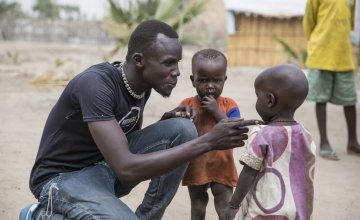 John Deng of South Sudanese NGO, Nile Hope, with some children on the island of Touchriak in Unity State. People have been hiding on the islands from fighting.
