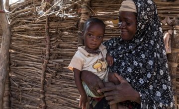 Rouaya with her son Salouhou at their home. Salouhou has just been admitted into Concern’s nutrition programme and has started treatment for Severe Acute Malnutrition. Photo: Apsatou Bagaya / Concern Worldwide.