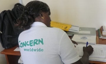 Community Health Volunteer Isabelle writing up her notes in Mukuru Health Centre in Kenya. Photo: Jennifer Nolan / Concern Worldwide.