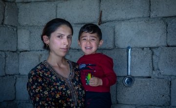Mother Amal with her youngest son Hevi (3) at their home in Iraq. Photo: Gavin Douglas/Concern Worldwide
