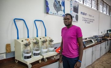 Steve Osumba, a Project Engineer at Maker Space, explaining their suction machine design process.