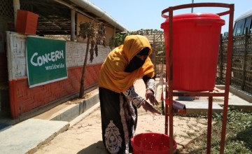 Kona, a Concern programme participant, washing her hands as a preventative measure to the spread of COVID-19