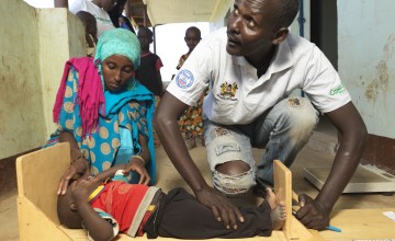 Father-of-five Mohammed Nurr Bonaya is Rufo’s Community Health Volunteer and checks his children for malnutrition, including his 18-month-old son Nura. Marsabit, Kenya, 2017. Photo: Peter Caton / Concern Worldwide.