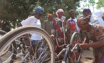 Influential women and traditional healers bicycle maintenance training session.