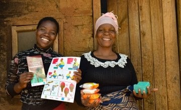 Juanita Kamwana and her daughter Jessie hold soap and Covid-19 fliers they received from Concern to help prevent the spread of Covid-19. Lilognwe, Malawi, 2020. Photo: Concern Worldwide.