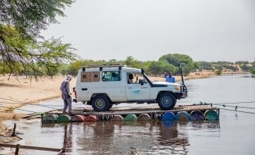 A Concern mobile health clinic rafts across a river to reach remote communities in the Lake Chad region.