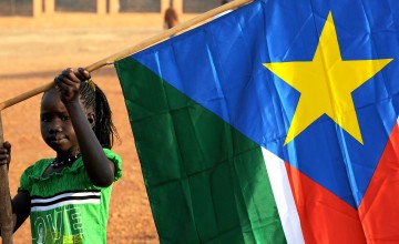 Girl with South Sudanese flag