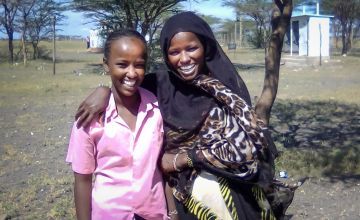 A young girl in Kenya with her mother