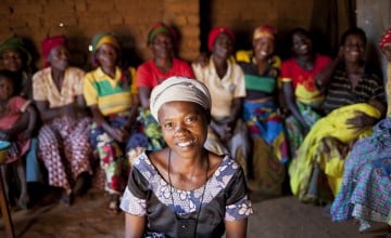 Jeanne D’Arc Niyingabiye, a beneficiary of Concern's Graduation Program, with her SILK group in Burundi.