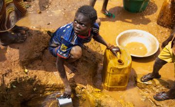 A young girl collecting water in Central African Republic