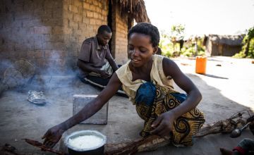 Woman cooking breakfast in DRC