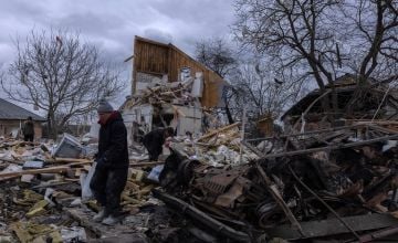 Igor Mojavey, 54, lost his wife and 12-year-old daughter in a Russian airstrike near Kyiv. He tries to find what’s left of his home in the rubble. Photo: Stefanie Glinski / Concern Worldwide.