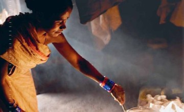 Sanamati Gauda, 28, is cooking at her home, Bharuamonda Village, Orissa, India, 2006. Photo: Mikkel Ostergaard / Panos.