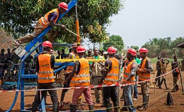 Community members drill a borehole for a new water source in Kouango, Central African Republic, following the destruction of several key water sites