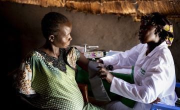 Pregnant Chagawa is seen by Concern midwife Rebekka at a Mobile Health Clinic in a remote rural area of Aweil, South Sudan