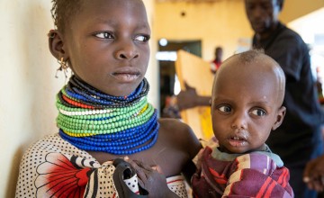 Ngirethi Ekakutan holds her younger sister, Mary Ekakutan.