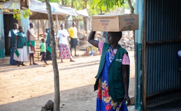 Preparing supplies for blanket supplementary feeding distirbutions at a nutrition site in Ethiopia. Photo: Kieran McConville