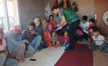 A Concern staff member assists beneficiaries at one of Concern's community centres in Sanliurfa.
