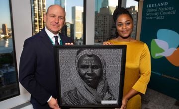 Concern Worldwide Haiti Programme Director, Victoria Jean-Louis, presents a photographic art piece which incorporates over 10,000 signatures for Concern’s Nothing Kills Like Hunger campaign to the Permanent Representative of Ireland to the United Nations, Fergal Mythen,.