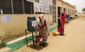 To help reduce the spread of COVID-19 beneficiaries wash hands before entering Concern supported Nutrition Facility in West Darfur. With support from Irish Aid, Concern Worldwide has installed 13 hand washing stations in 13 health facilities. Photo: Concern Worldwide.