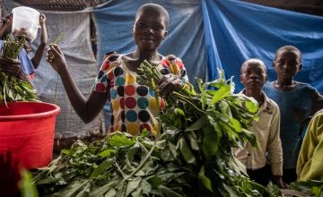 Congolese woman at the market with her produce