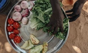 Cooking demonstration of vegetables harvested at a home garden in Niger
